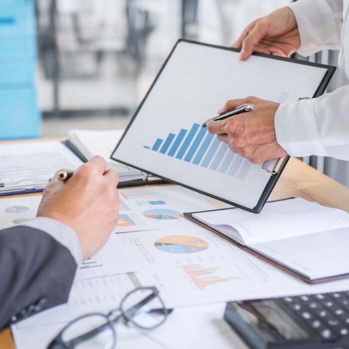 Partner meeting of business team colleagues consultation and discussion marketing plan meeting concept on financial report and analyzing investment project to development grow to success.