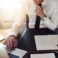 Business man working at office with laptop and documents on his desk, consultant lawyer concept